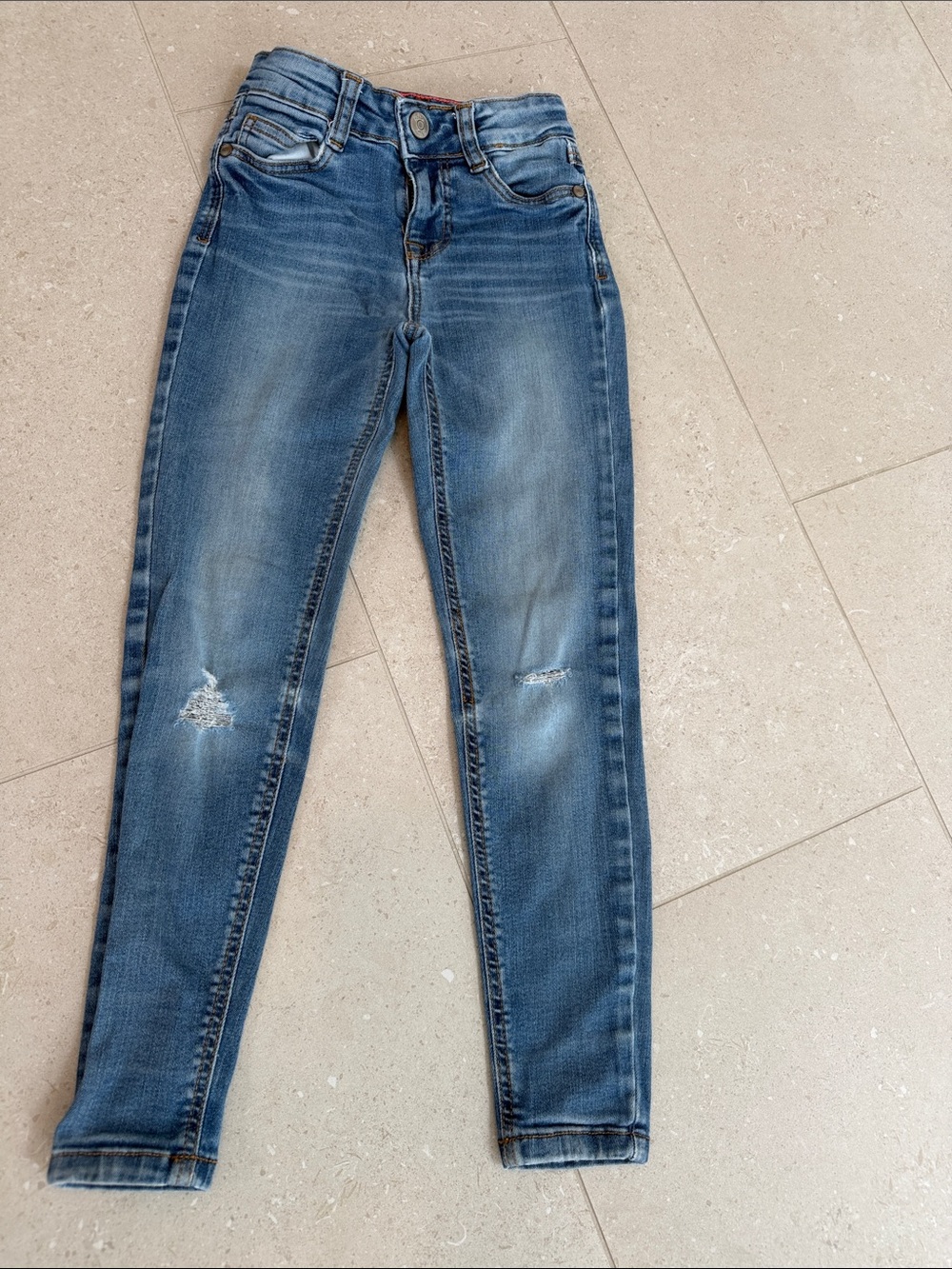 Mini Boden faded blue girls' skinny jeans with light distressing